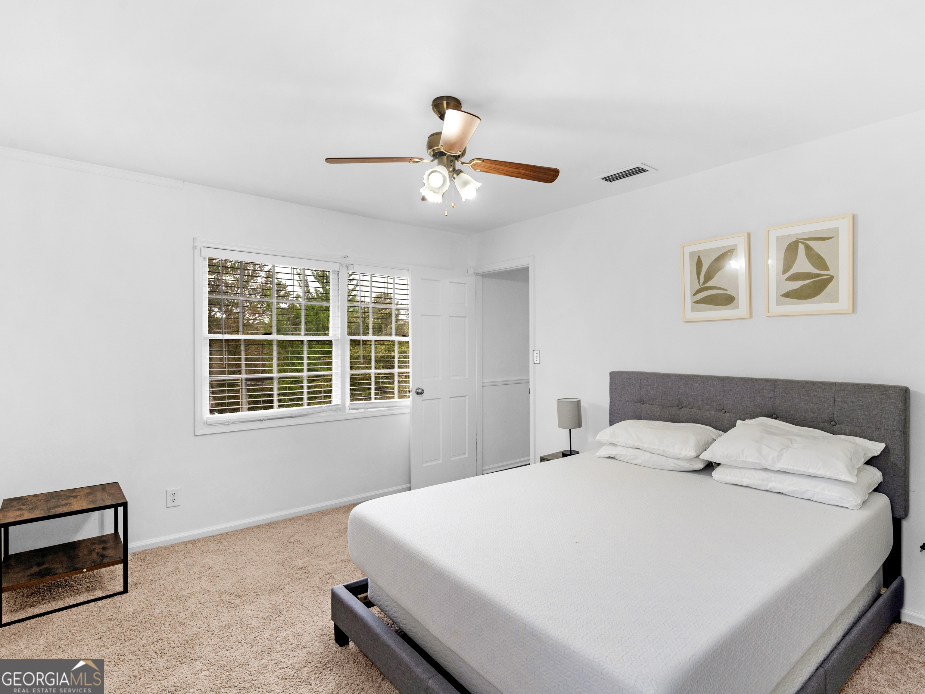 262 Rhodes Drive Athens, GA 30606 - Photo 18 of 21 a bedroom with a large bed and a window