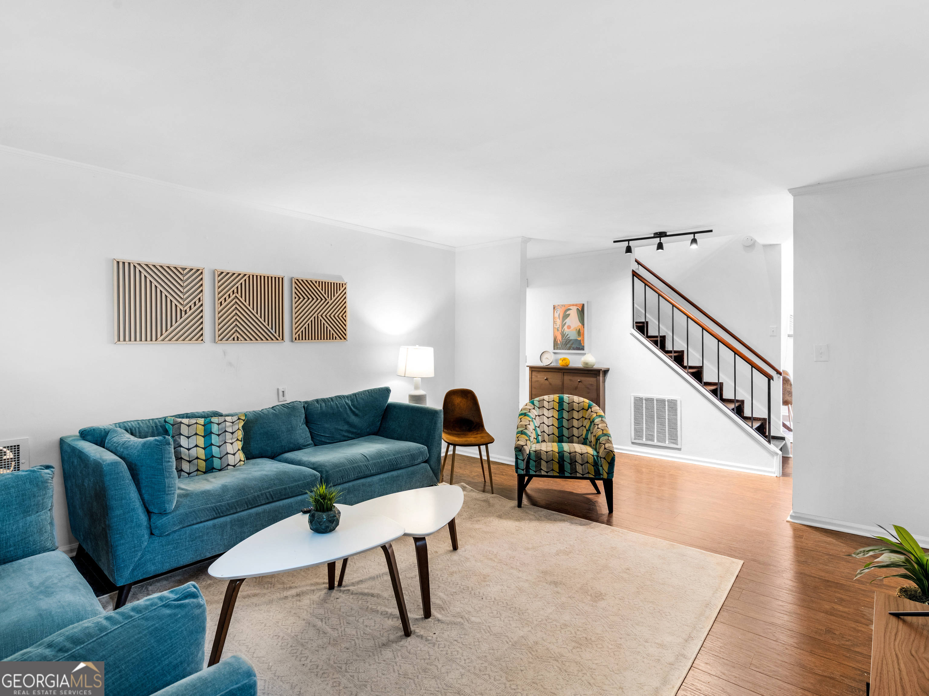 262 Rhodes Drive Athens, GA 30606 - Photo 5 of 21 a living room with furniture and a potted plant