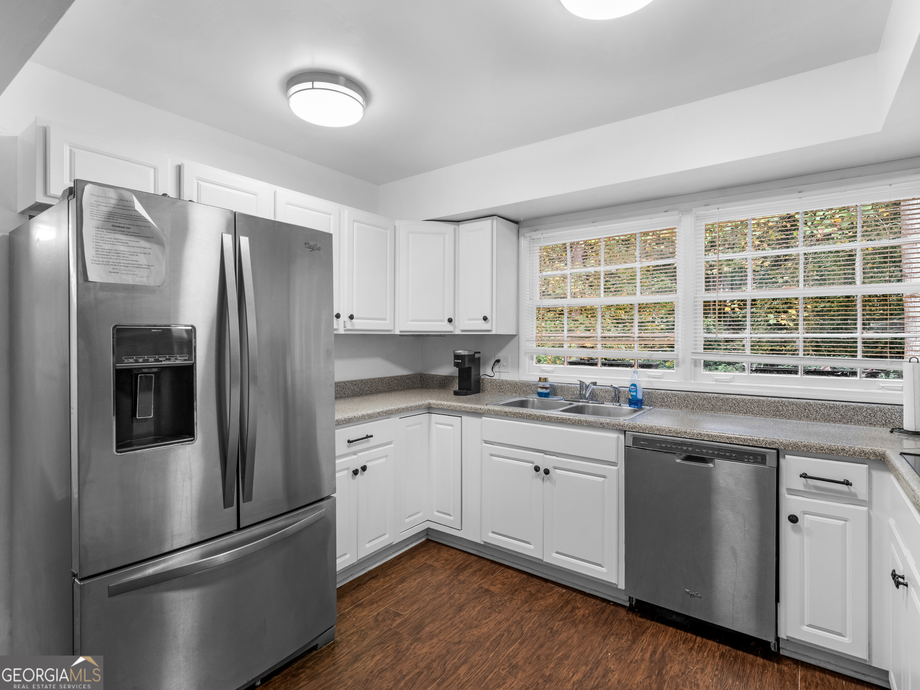 262 Rhodes Drive Athens, GA 30606 - Photo 8 of 21 a kitchen with granite countertop stainless steel appliances a sink and a window