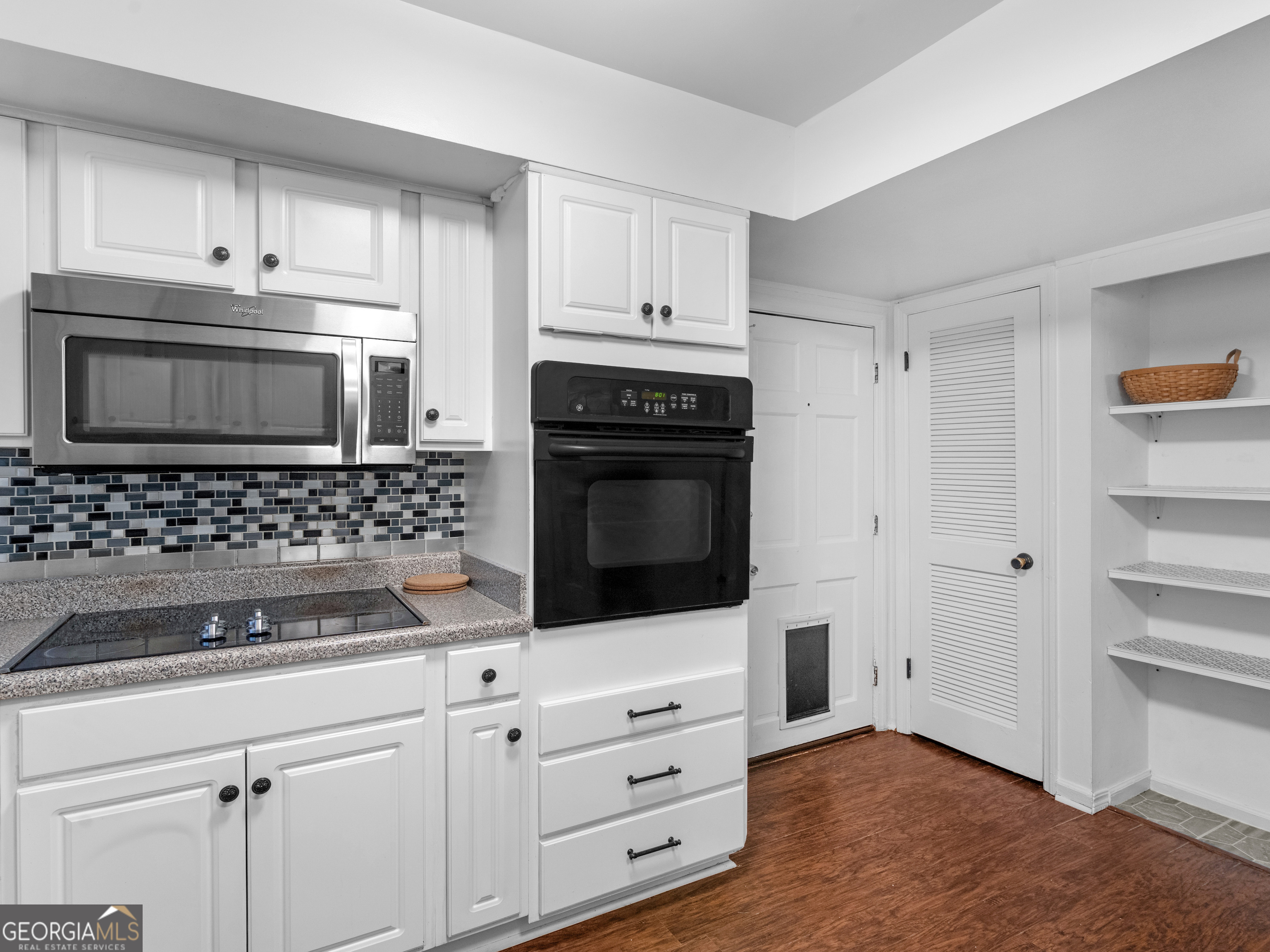 262 Rhodes Drive Athens, GA 30606 - Photo 10 of 21 a kitchen with white cabinets and appliances