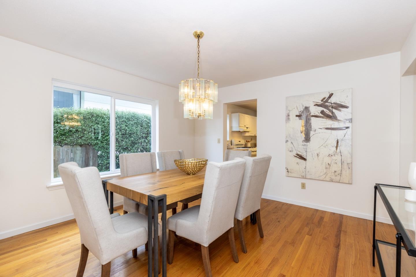 1415 Grand Avenue Pacifica, CA 94044 - Photo 12 of 47 a view of a dining room with furniture window and wooden floor