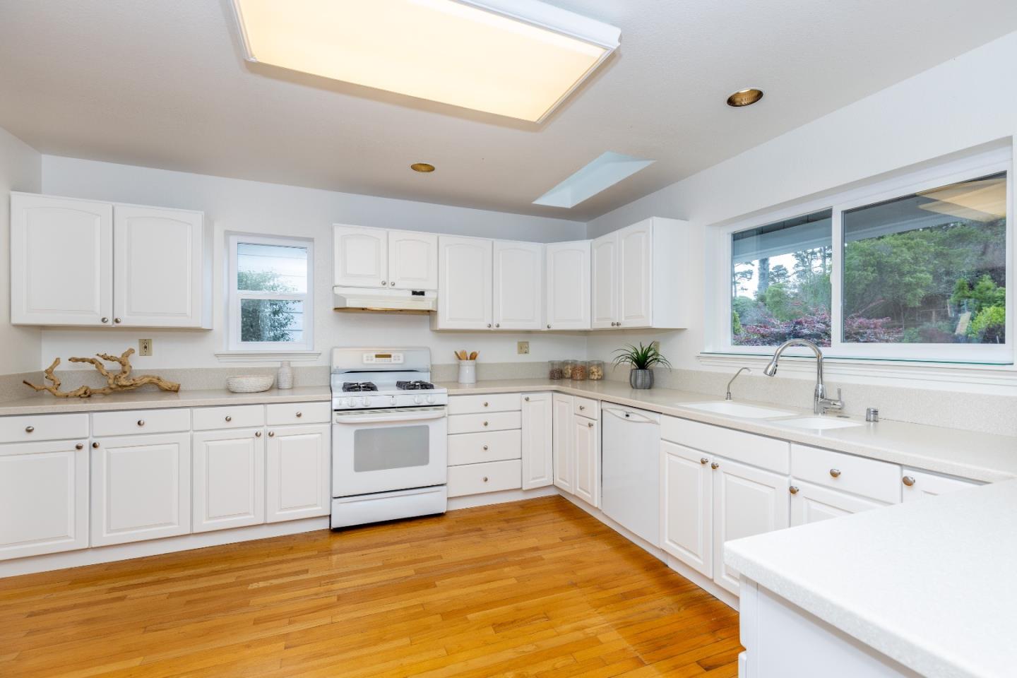 1415 Grand Avenue Pacifica, CA 94044 - Photo 15 of 47 a large kitchen with cabinets and wooden floor