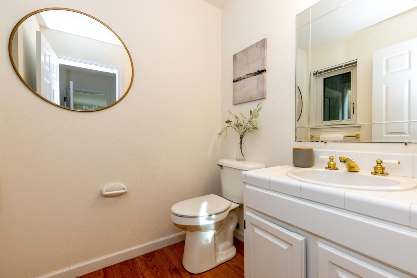 1415 Grand Avenue Pacifica, CA 94044 - Photo 31 of 47 a bathroom with a sink toilet and mirror