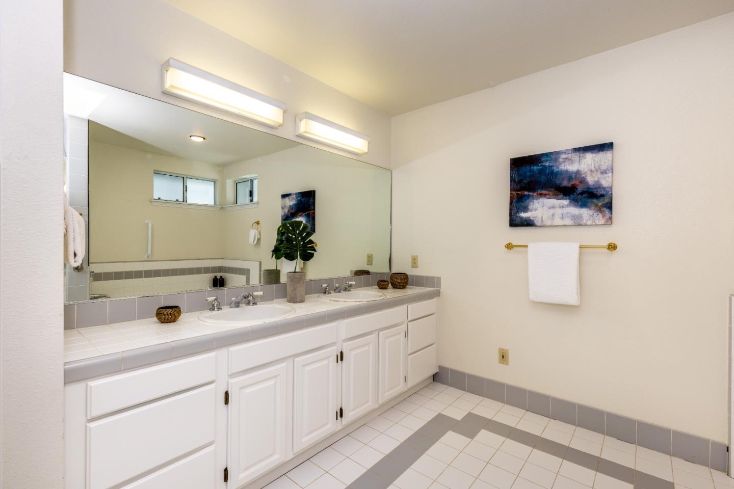 1415 Grand Avenue Pacifica, CA 94044 - Photo 33 of 47 a bathroom with a double vanity sink and mirror