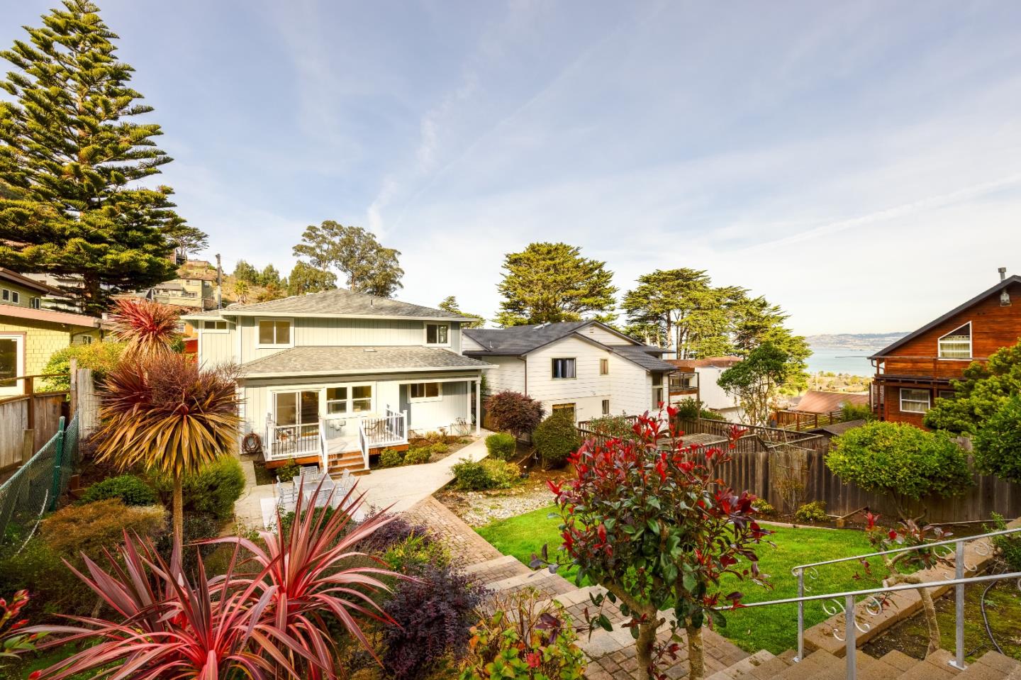 1415 Grand Avenue Pacifica, CA 94044 - Photo 37 of 47 a view of a house with a big yard and potted plants