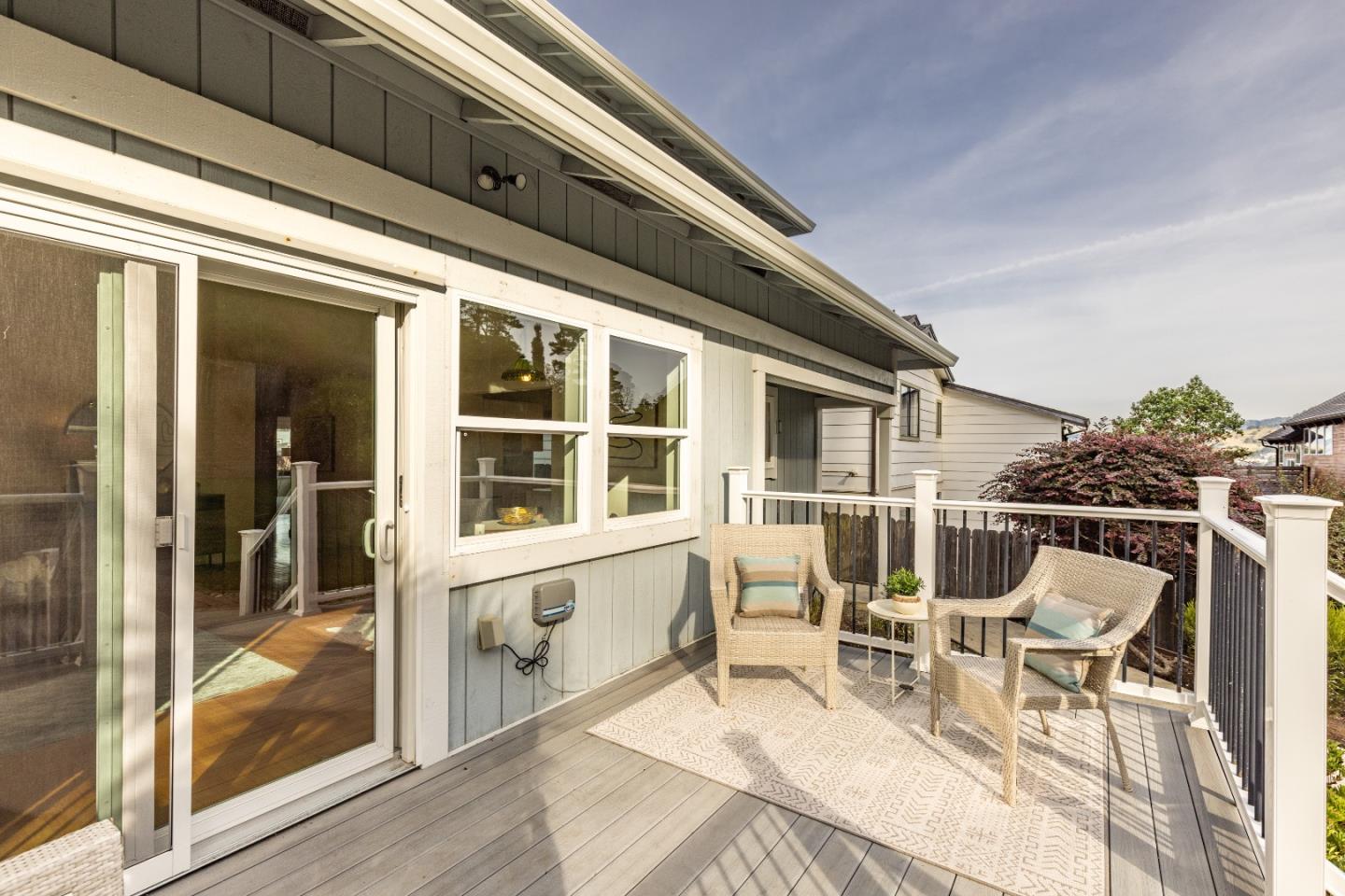 1415 Grand Avenue Pacifica, CA 94044 - Photo 41 of 47 a view of a house with chairs and table in a patio