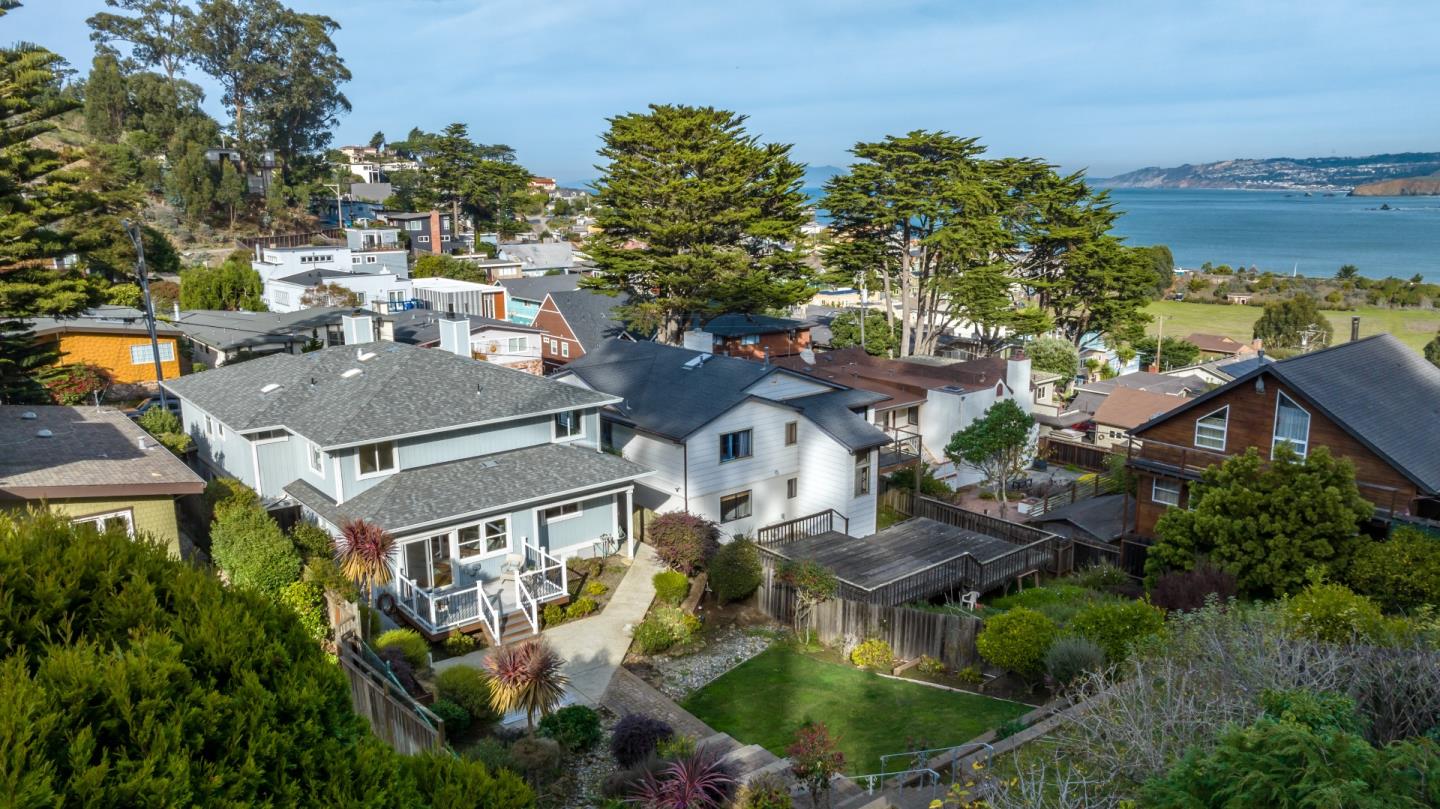 1415 Grand Avenue Pacifica, CA 94044 - Photo 46 of 47 a aerial view of a house with a garden and lake view