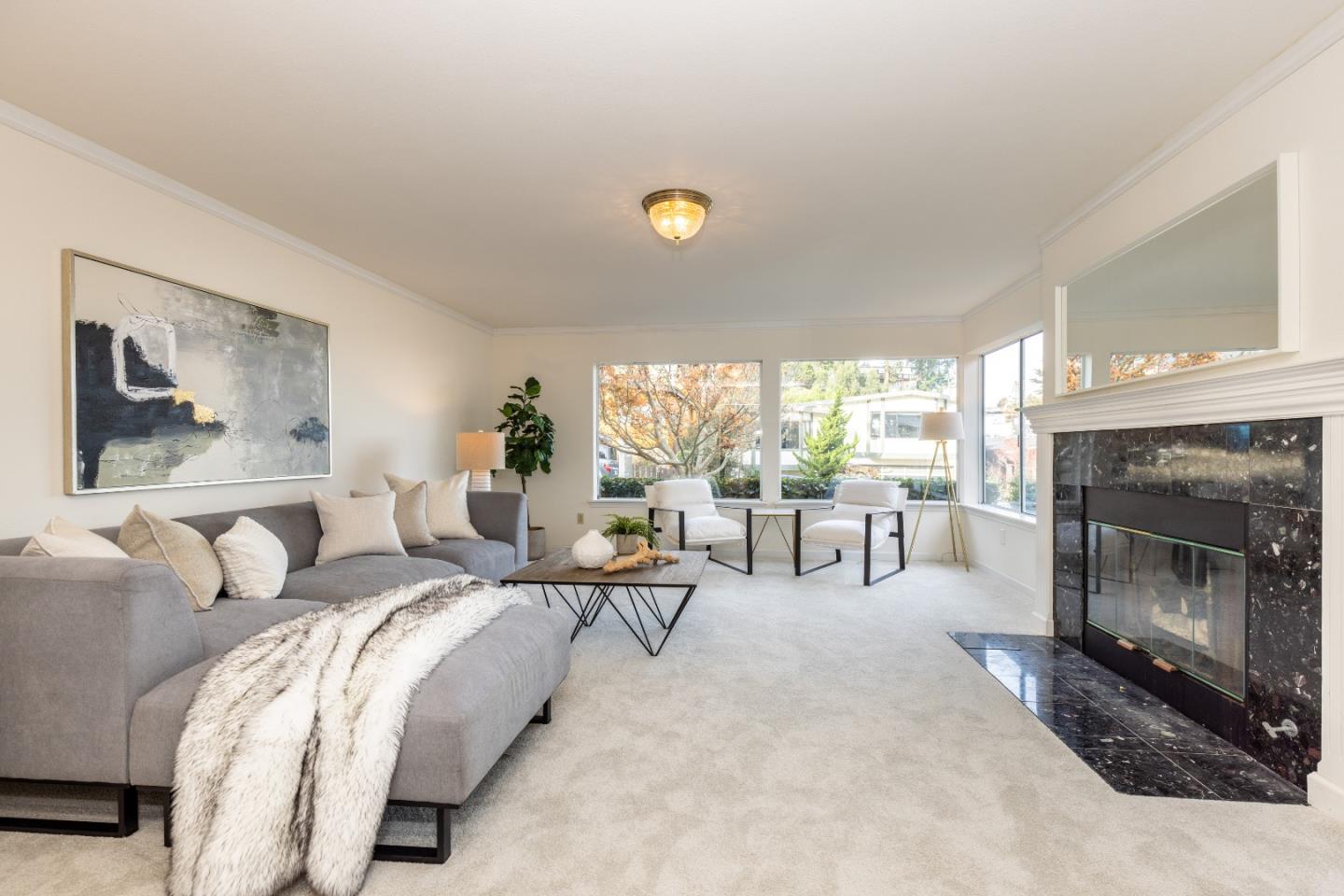 1415 Grand Avenue Pacifica, CA 94044 - Photo 9 of 47 a living room with furniture a large window and a fireplace
