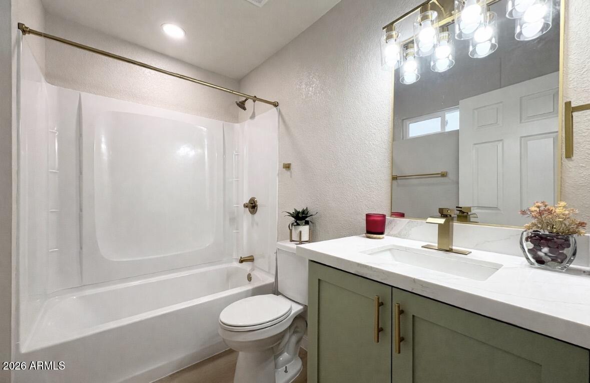 175 South Matilda Street Florence, AZ 85132 - Photo 14 of 16 a bathroom with a sink a toilet and shower