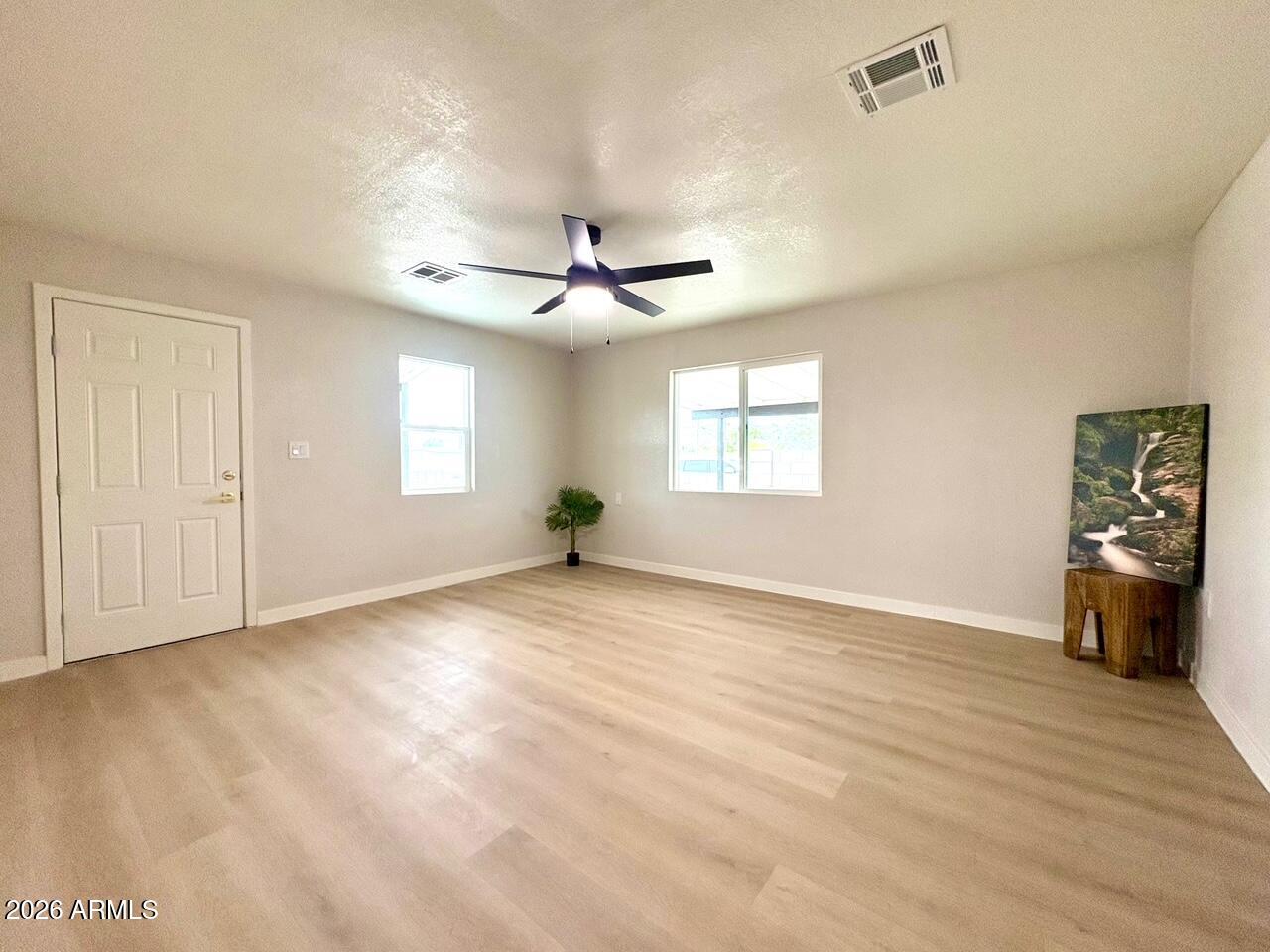 175 South Matilda Street Florence, AZ 85132 - Photo 4 of 16 a view of an empty room with a window
