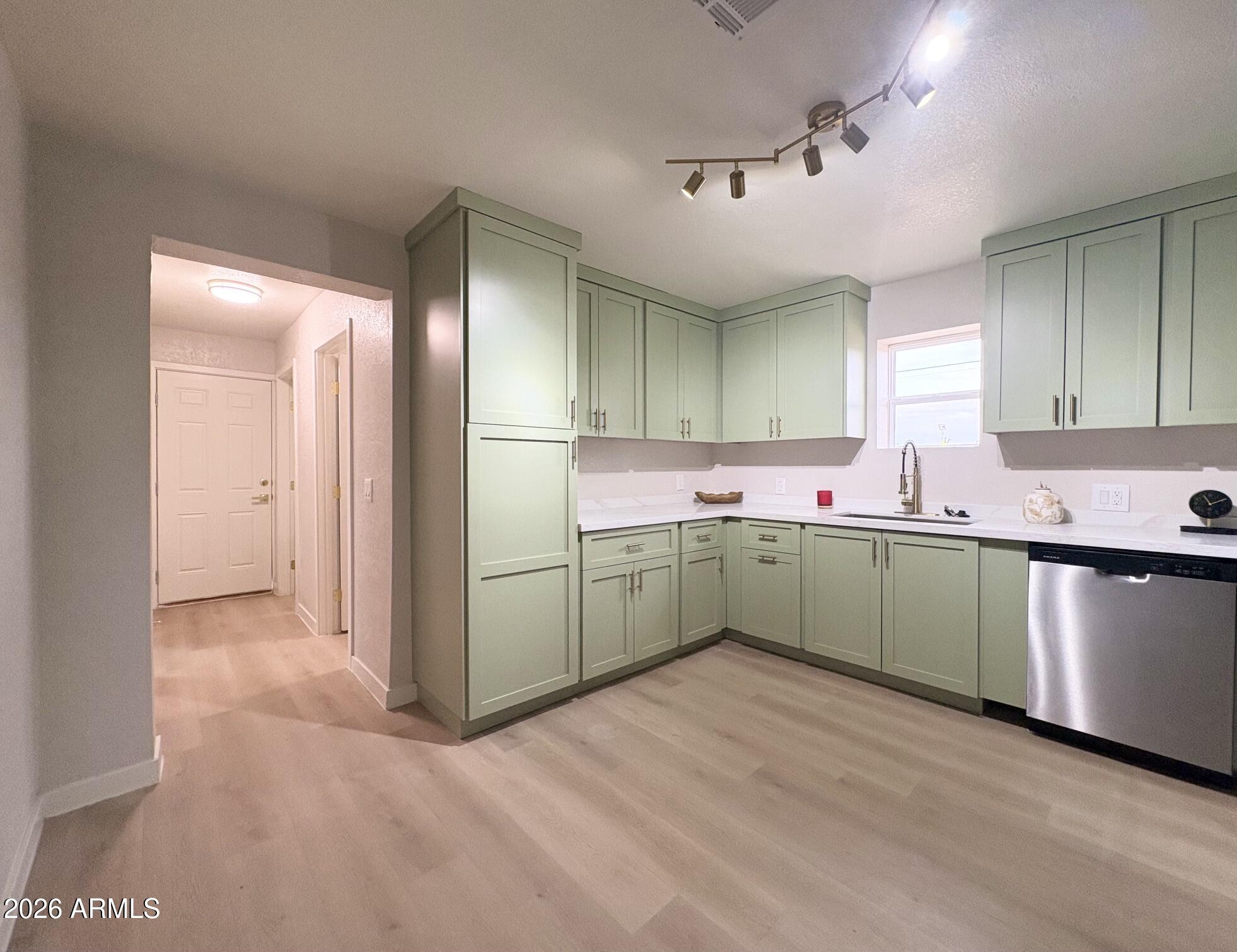 175 South Matilda Street Florence, AZ 85132 - Photo 7 of 16 a kitchen with a sink cabinets and window