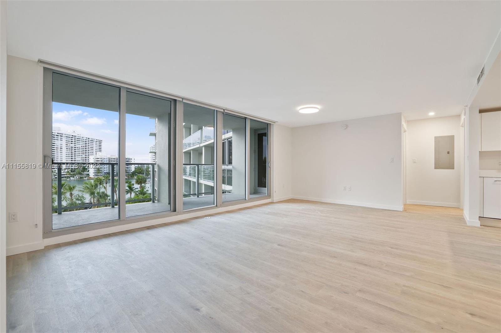 1504 Bay Road, Unit N1508 Miami Beach, FL 33139 - Photo 6 of 89 a view of an empty room with a sliding door