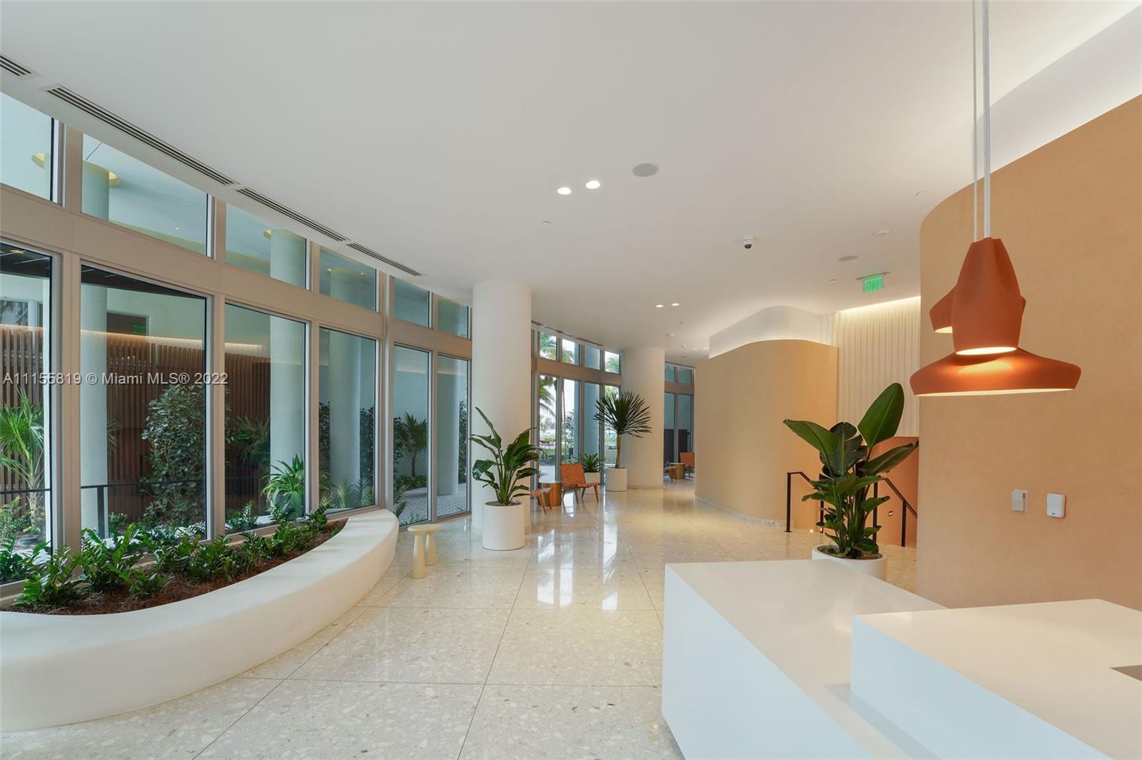 1504 Bay Road, Unit N1508 Miami Beach, FL 33139 - Photo 77 of 89 a lobby with furniture and a potted plant