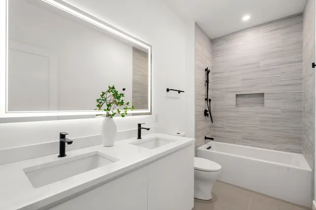 a bathroom with a sink a toilet and a bathtub