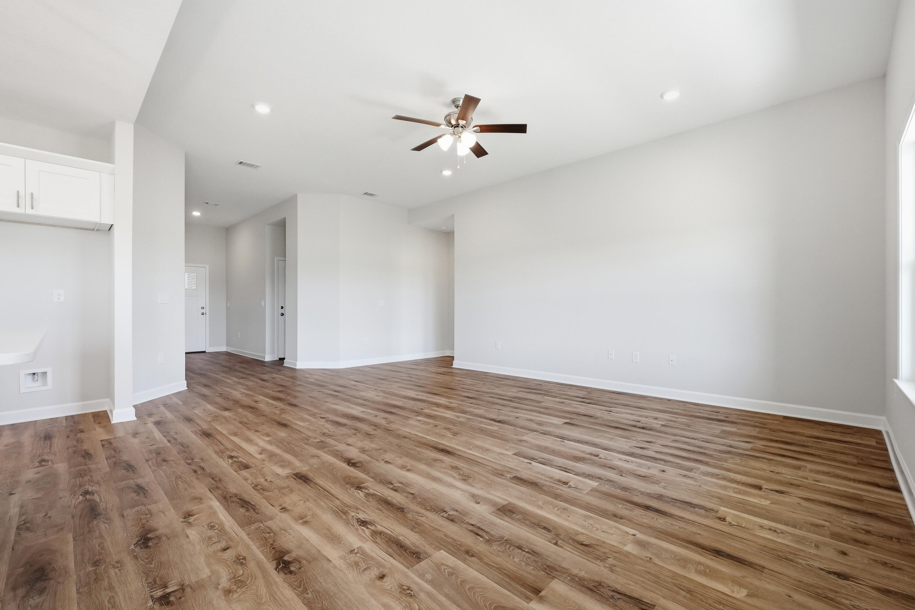 6114 Mildreds Way Crestview, FL 32539 - Photo 6 of 24 a view of empty room with wooden floor