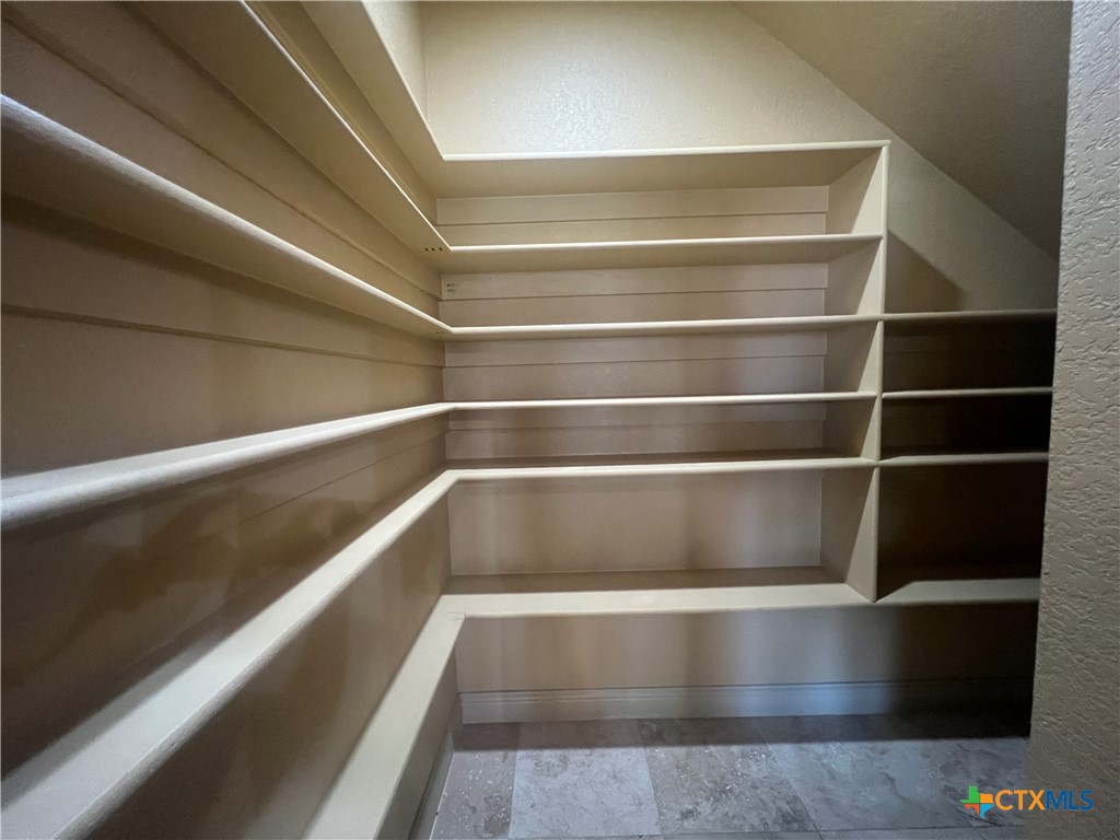523 Messer Ranch Road Belton, TX 76513 - Photo 18 of 40 a view of walk in closet with empty racks