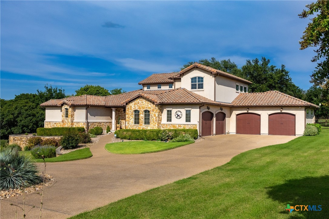 523 Messer Ranch Road Belton, TX 76513 - Photo 2 of 40 a front view of a house with a yard and garage