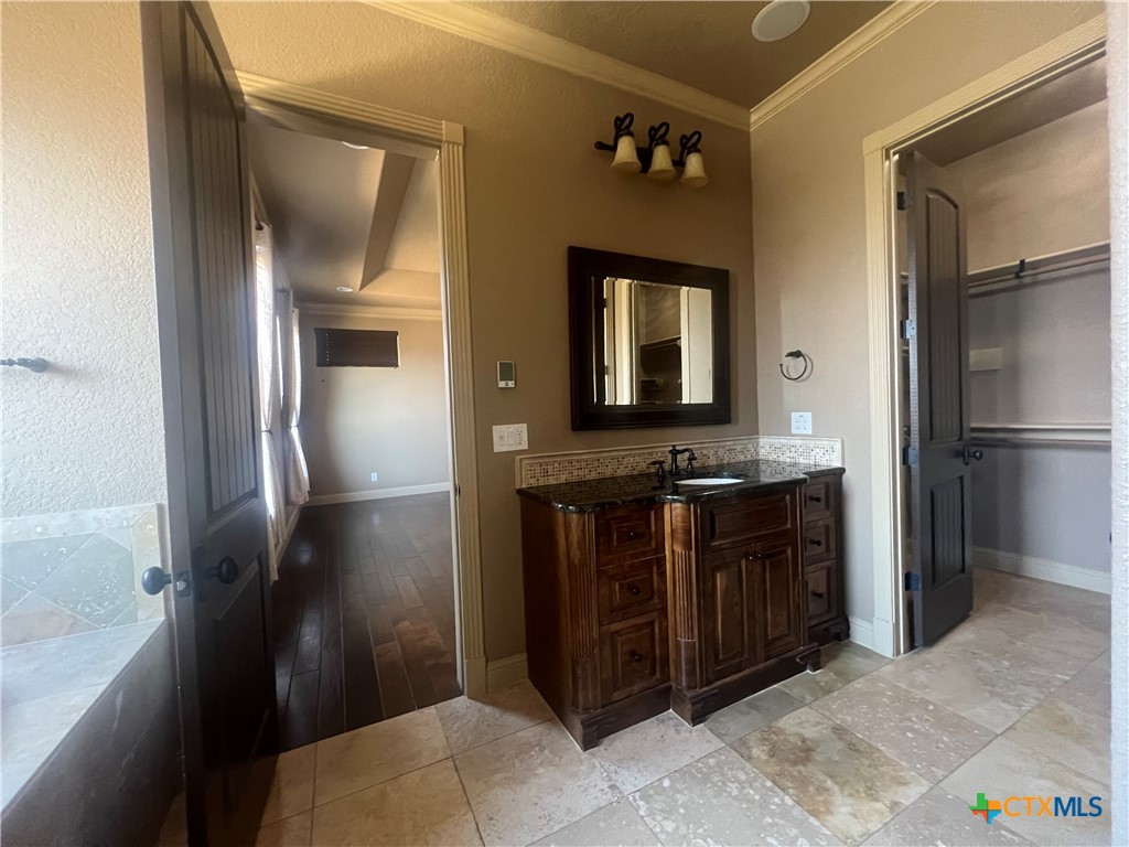 523 Messer Ranch Road Belton, TX 76513 - Photo 21 of 40 a bathroom with a sink and a mirror