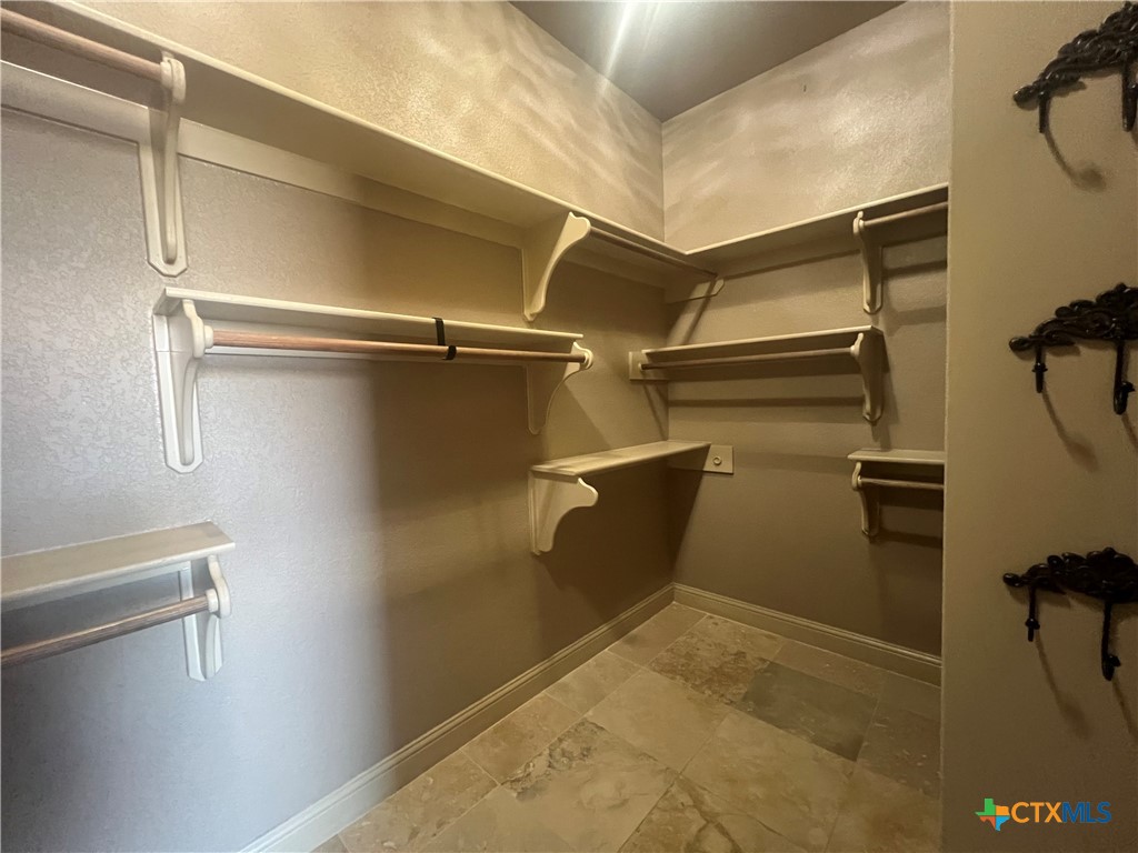 523 Messer Ranch Road Belton, TX 76513 - Photo 24 of 40 a view of a room with racks on the wall