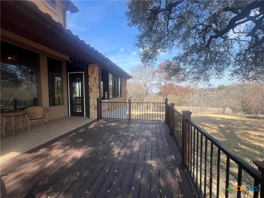 523 Messer Ranch Road Belton, TX 76513 - Photo 30 of 40 a view of a patio with wooden floor and iron fence