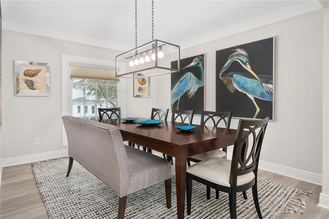 a bathroom with a sink a toilet a large mirror and shower
