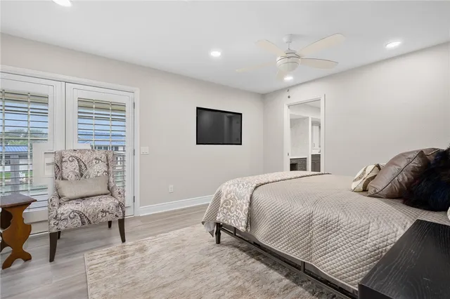 a bathroom with a granite countertop sink a mirror a vanity and a shower