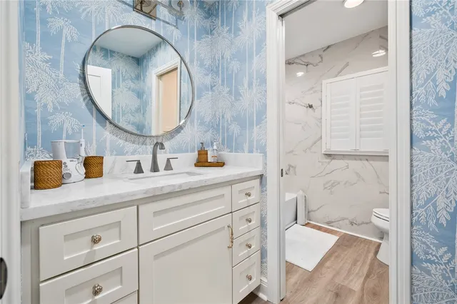 a view of a lake with a house next to a lake