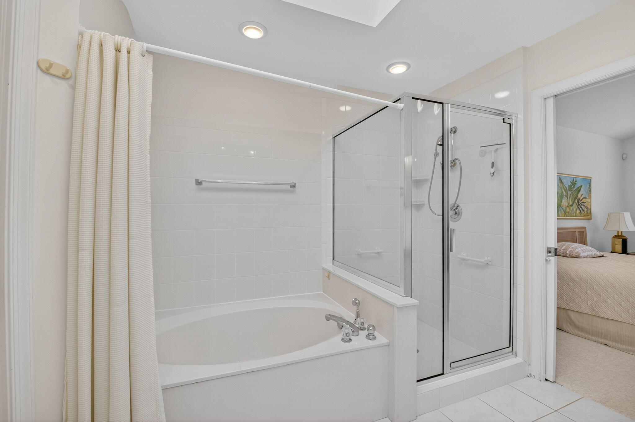 5309 Northwest 26th Circle Boca Raton, FL 33496 - Photo 20 of 37 a bathroom with a bathtub and a shower