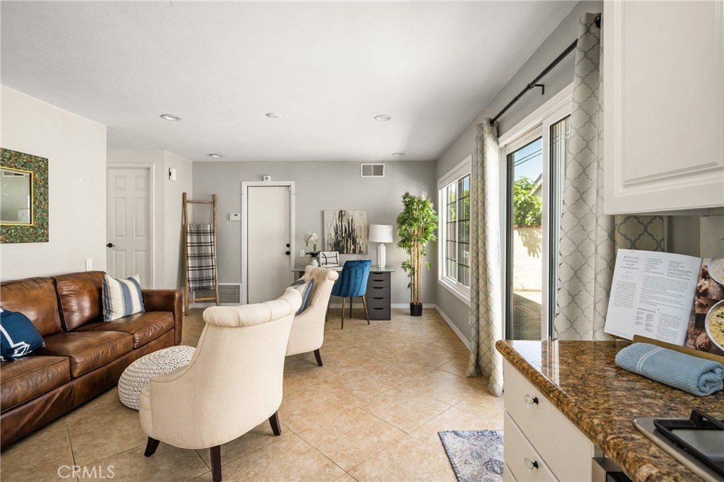 9 Newmeadow Irvine, CA 92614 - Photo 13 of 36 a living room with furniture and a window