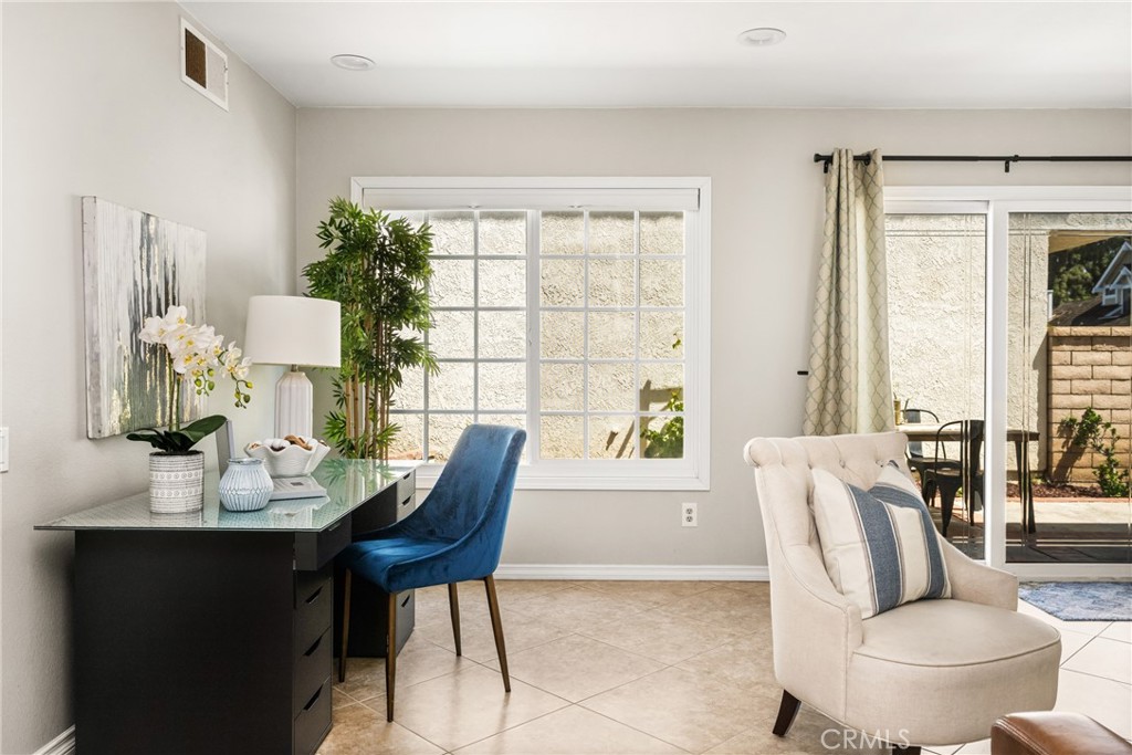 9 Newmeadow Irvine, CA 92614 - Photo 15 of 36 a living room with furniture and a window