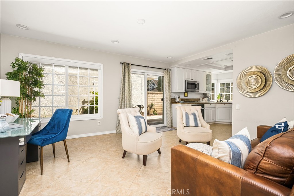 9 Newmeadow Irvine, CA 92614 - Photo 16 of 36 a living room with furniture and a large window