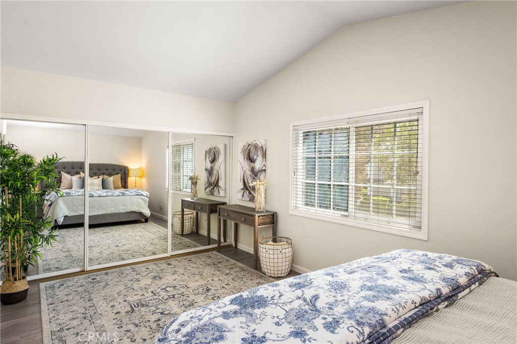 9 Newmeadow Irvine, CA 92614 - Photo 18 of 36 a bedroom with a large bed and a window