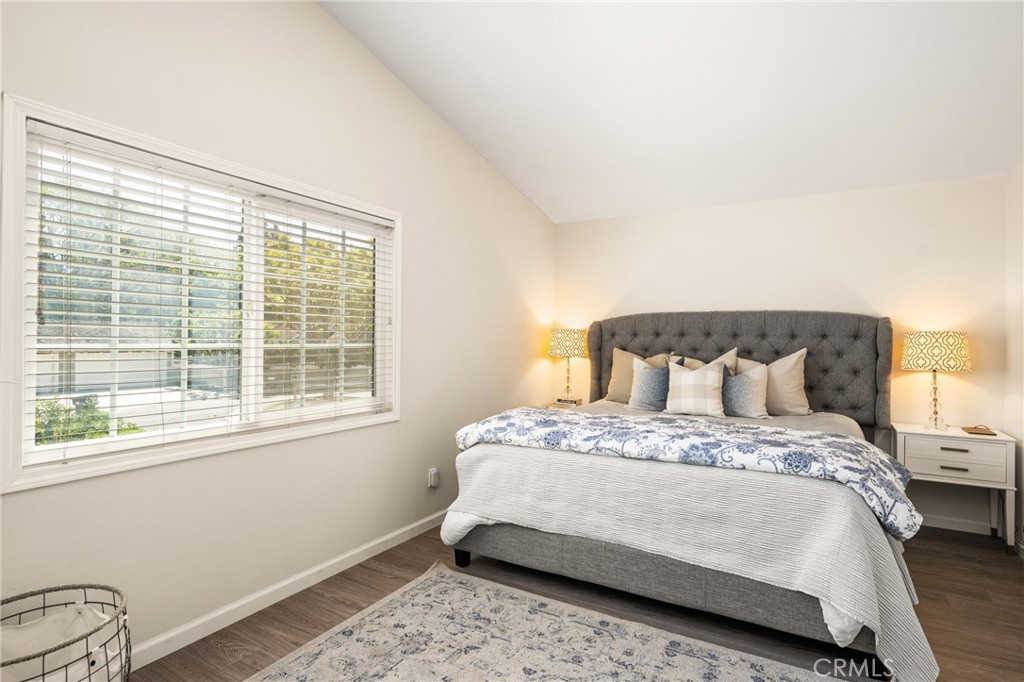 9 Newmeadow Irvine, CA 92614 - Photo 19 of 36 a bedroom with a bed and wooden floor