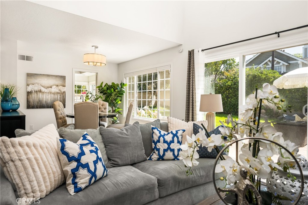 9 Newmeadow Irvine, CA 92614 - Photo 2 of 36 a living room with furniture and a large window
