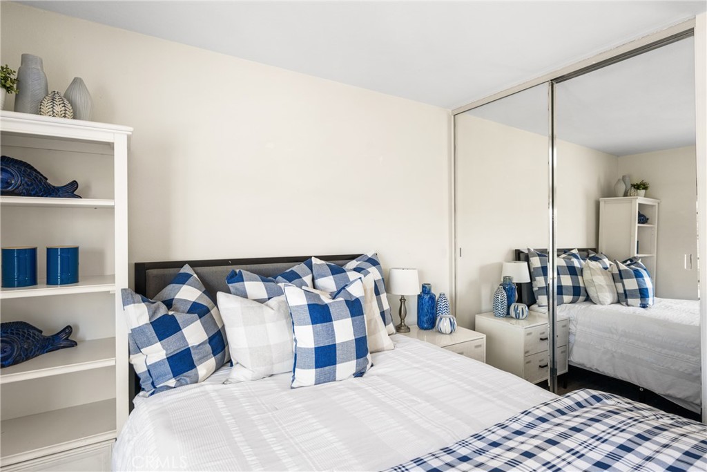 9 Newmeadow Irvine, CA 92614 - Photo 26 of 36 a bedroom with a bed and a mirror on dresser