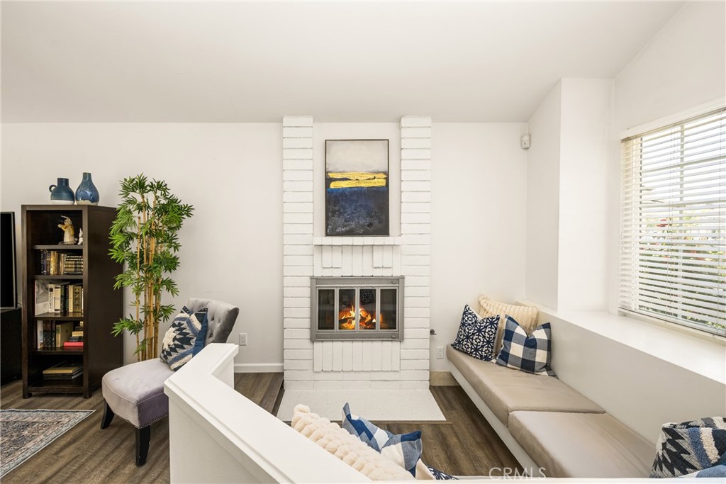 9 Newmeadow Irvine, CA 92614 - Photo 3 of 36 a living room with furniture and a fireplace