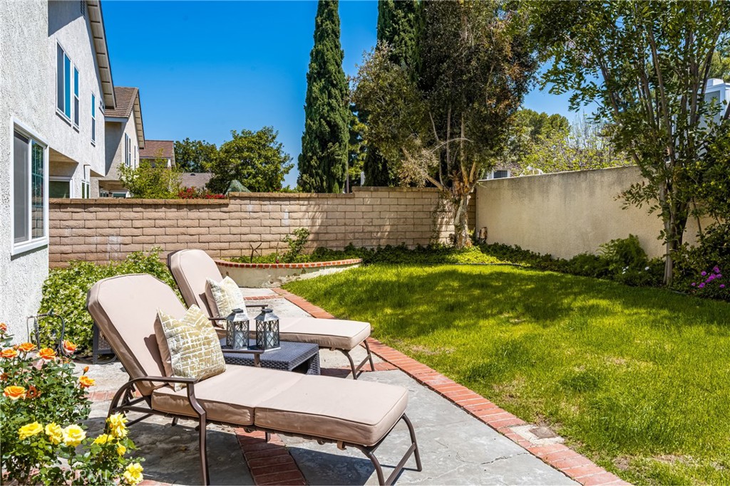 9 Newmeadow Irvine, CA 92614 - Photo 32 of 36 a view of yard with seating area and trees around