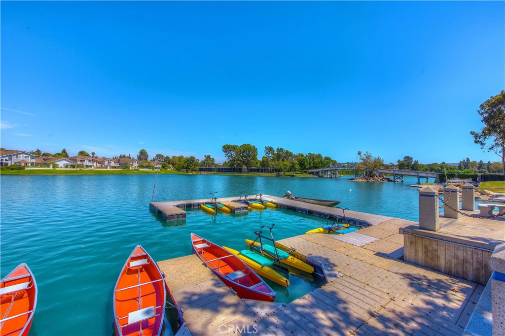 9 Newmeadow Irvine, CA 92614 - Photo 35 of 36 a view of a lake with couches chairs