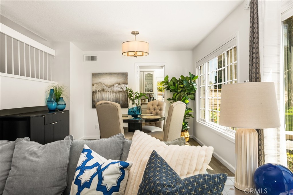 9 Newmeadow Irvine, CA 92614 - Photo 6 of 36 a living room with furniture and a window