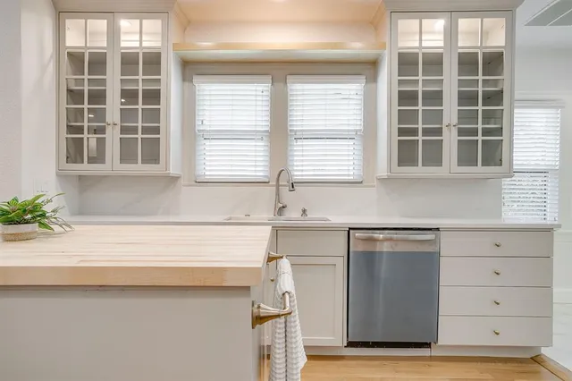 a kitchen with a sink and a window