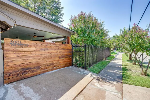 a view of a pathway of a house with a yard