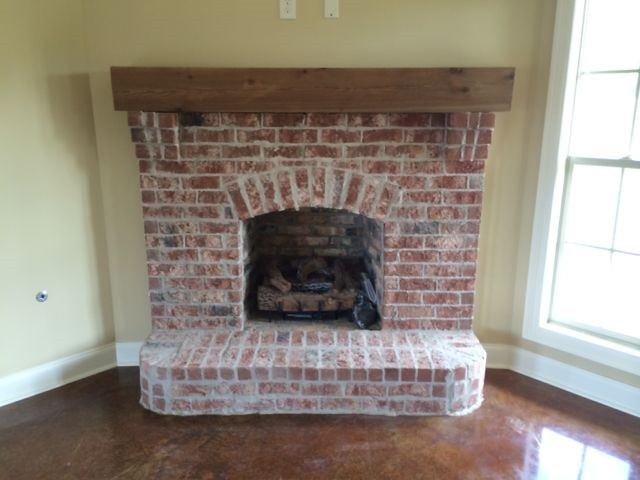443 Greenfield Ridge Circle Brandon, MS 39042 - Photo 5 of 15 Fireplace with hearth and rustic mantel.