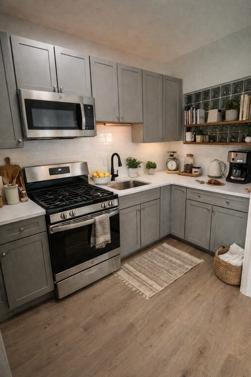 108 Bristol Road, Unit 1 Somerville, MA 02144 - Photo 2 of 24 a kitchen with a sink stove and microwave