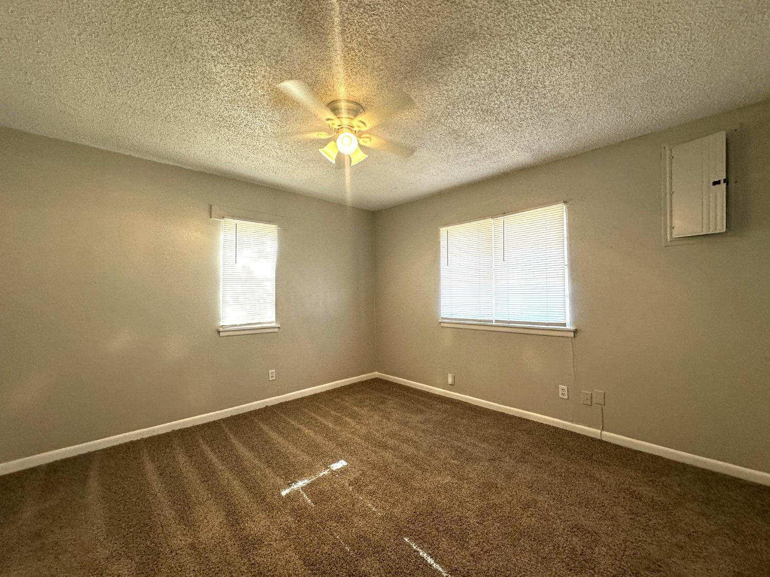 5005 39th Street Lubbock, TX 79414 - Photo 4 of 10 an empty room with a window