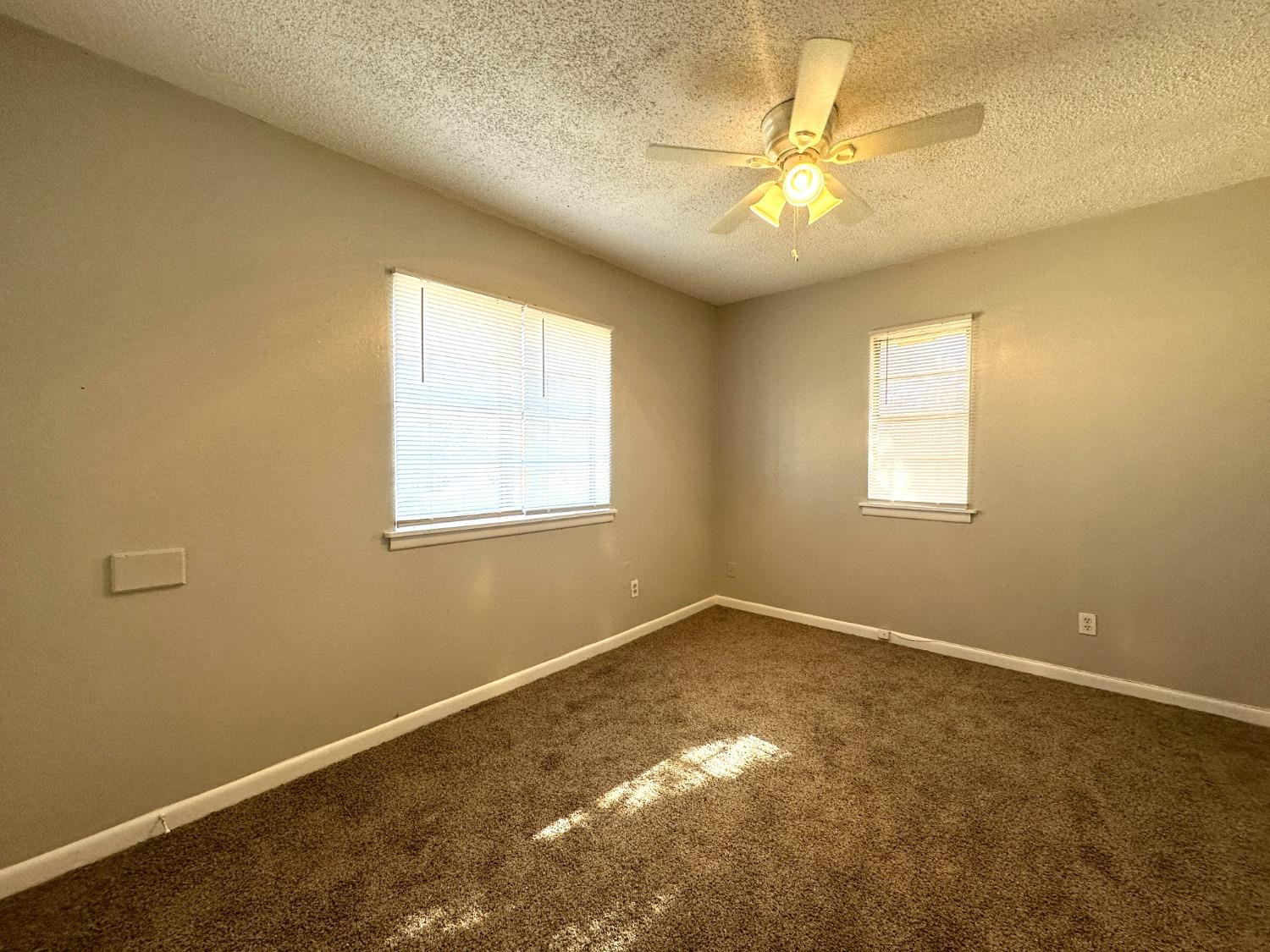 5005 39th Street Lubbock, TX 79414 - Photo 8 of 10 a view of a livingroom with a window