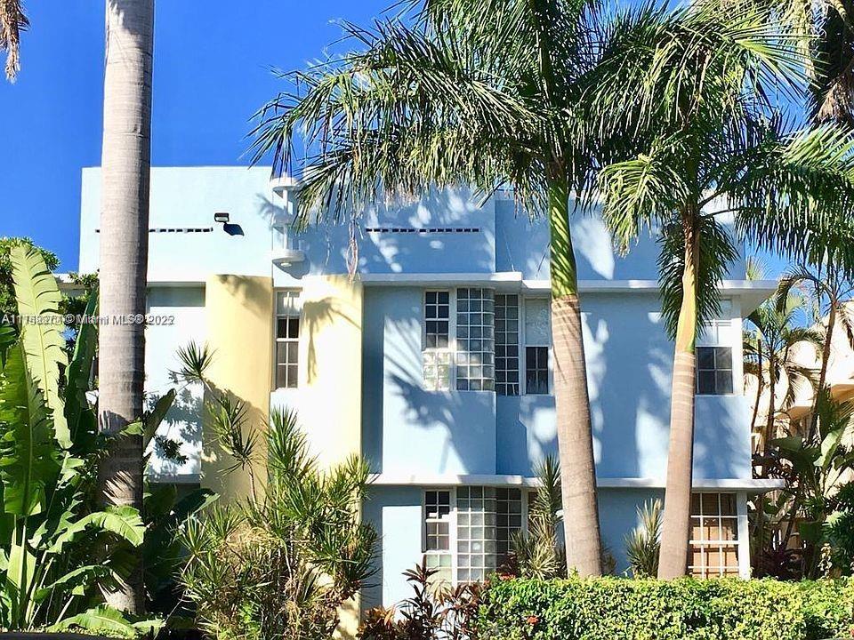 Flamingo-Lummus Miami Beach, FL 33139 - Photo 1 of 4 a front view of a multi story residential apartment building with a yard