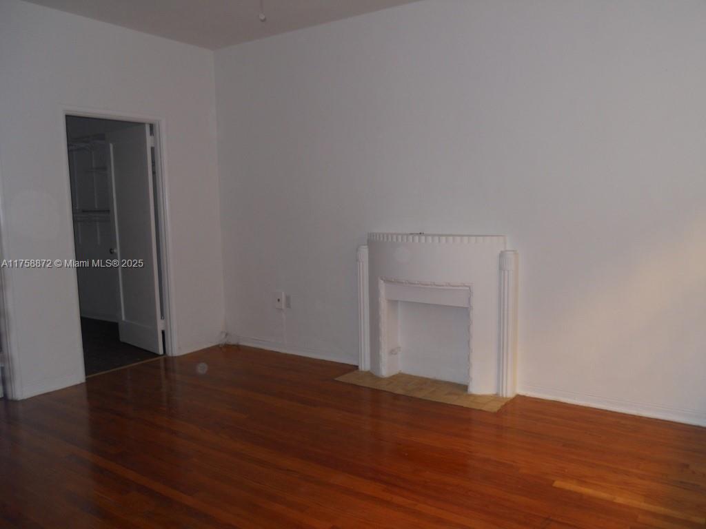 Flamingo-Lummus Miami Beach, FL 33139 - Photo 2 of 4 a view of an empty room with wooden floor and closet