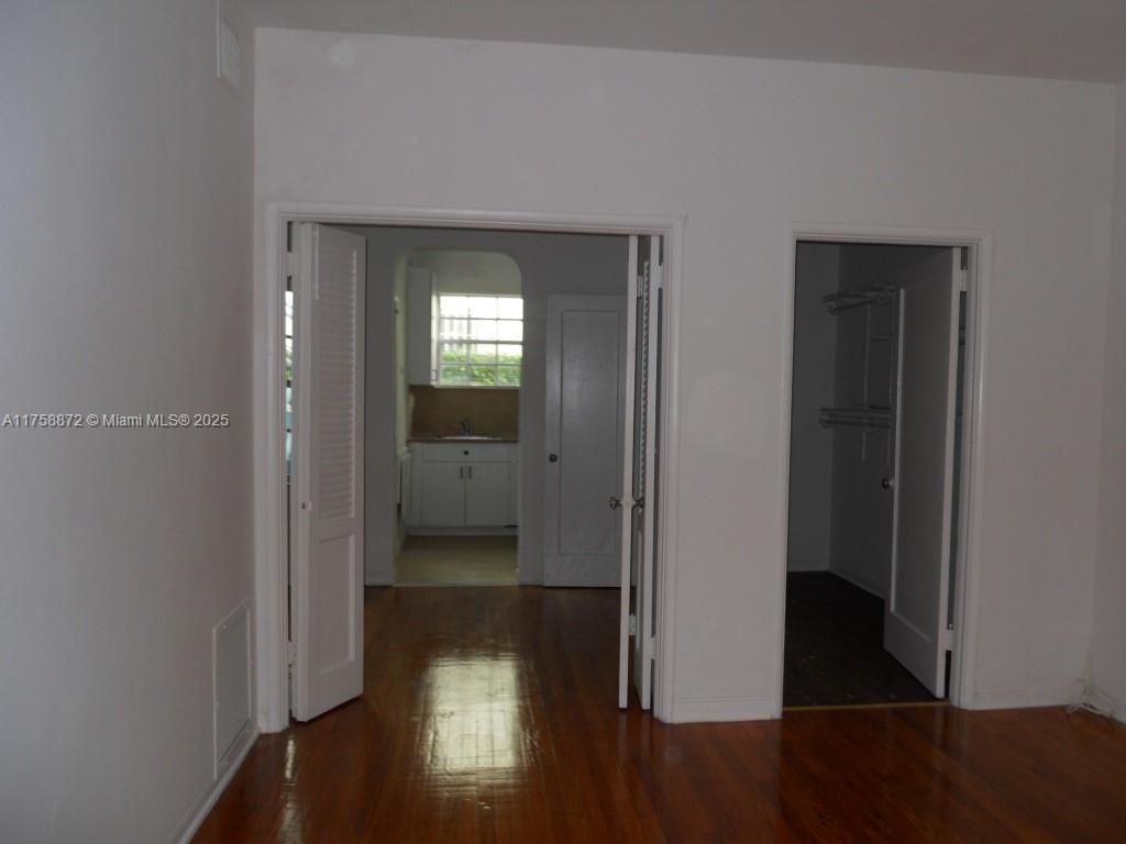 Flamingo-Lummus Miami Beach, FL 33139 - Photo 3 of 4 a view of a hallway with wooden floor
