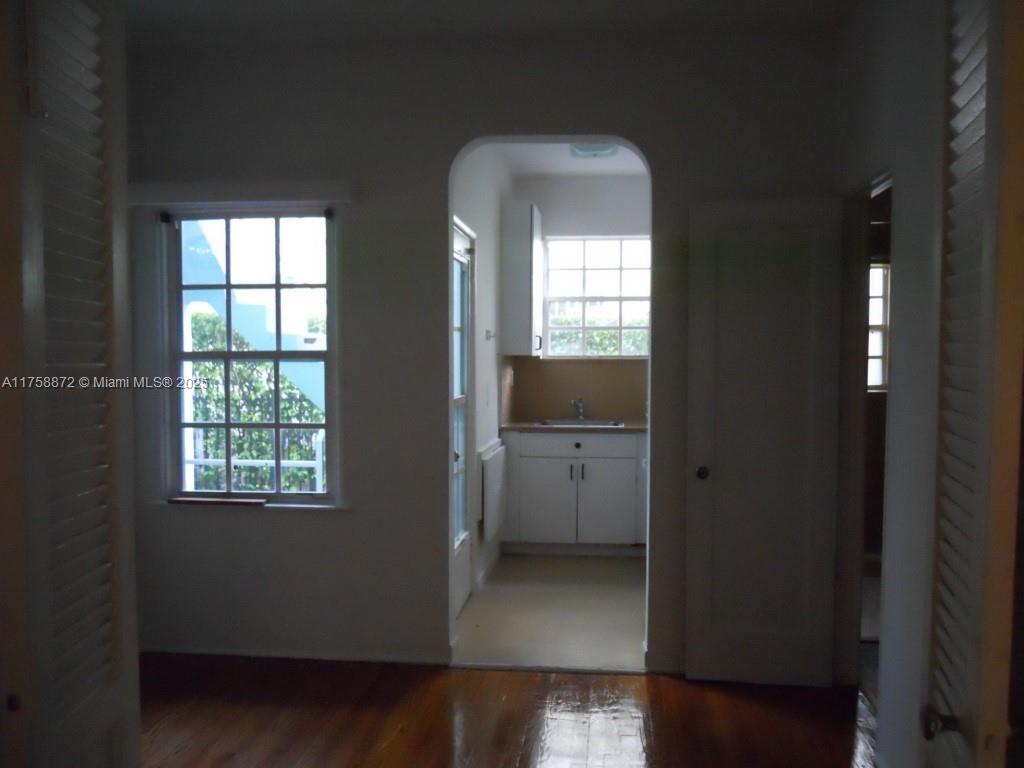Flamingo-Lummus Miami Beach, FL 33139 - Photo 4 of 4 a view of hallway with a window and wooden floor