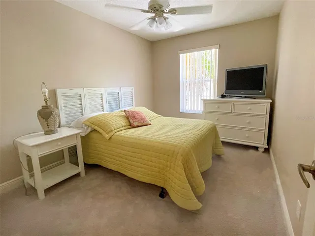 a bedroom with a bed and a lamp